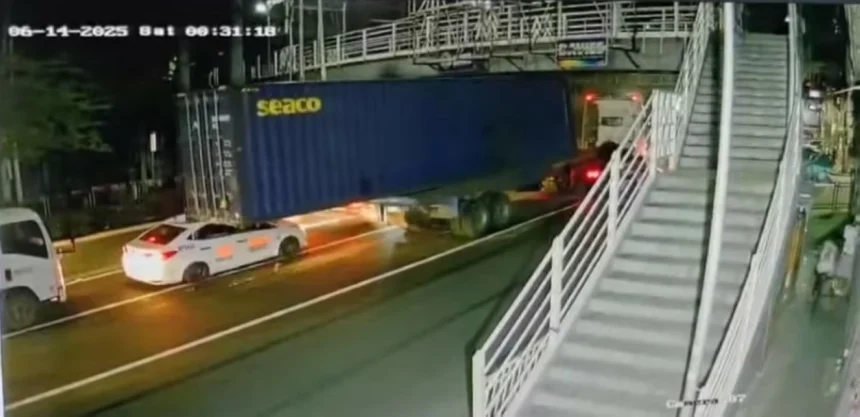 Taxi crushed after container falls from trailer truck in Manila